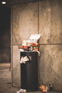 This image shows the waste crisis caused by single-use food packaging.